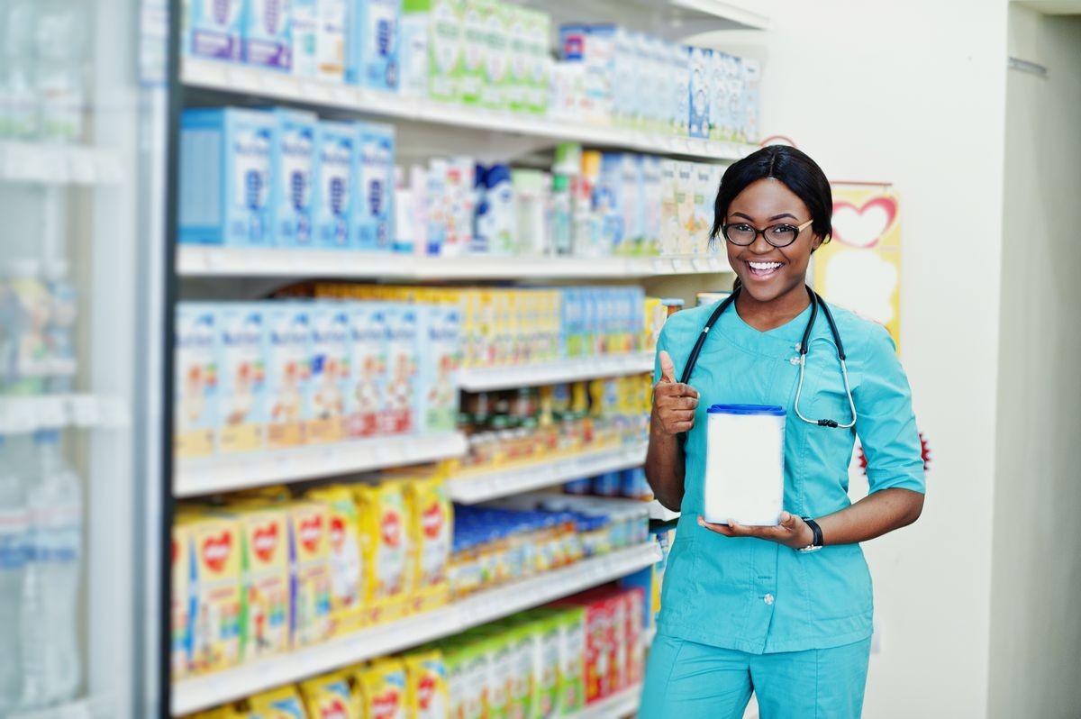 African american pharmacist working in drugstore at hospital pharmacy. African healthcare.